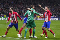 Atletico Madrid players celebrate winning the Champions League, round of 16, second leg soccer match against Inter Milan at the Metropolitano stadium in Madrid, Spain, Wednesday, March 13, 2024. Atletico Madrid won 3-2 in a penalty shootout. (AP Photo/Manu Fernandez)