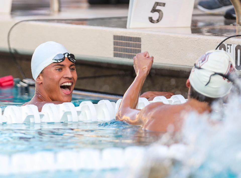 Palm Desert’s Logan DeGraeve smiles at La Quinta’s Tonalli Sanchez as the two realize they tied with a time of 4:52.74 in the boys 500-yard freestyle during the DEL individual swim finals at La Quinta High School in La Quinta, Calif., Thursday, April 28, 2022.