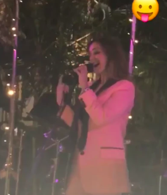 Louise singing her heart out at a friend’s wedding the night before her quickie divorce was granted (Instagram)