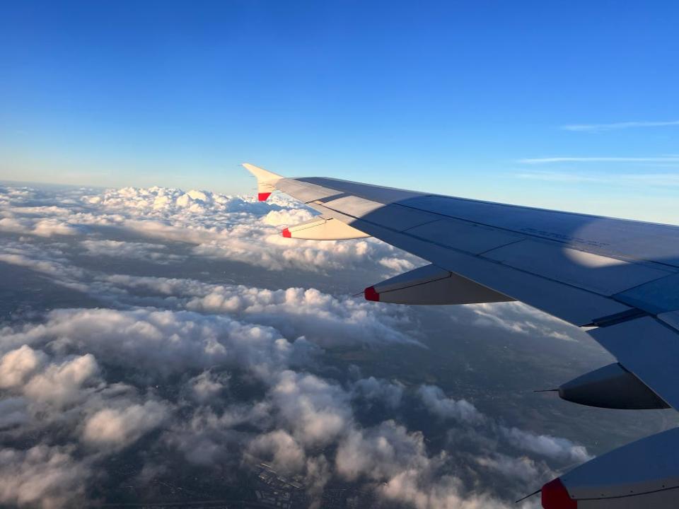 A view of outside the plane in the air.