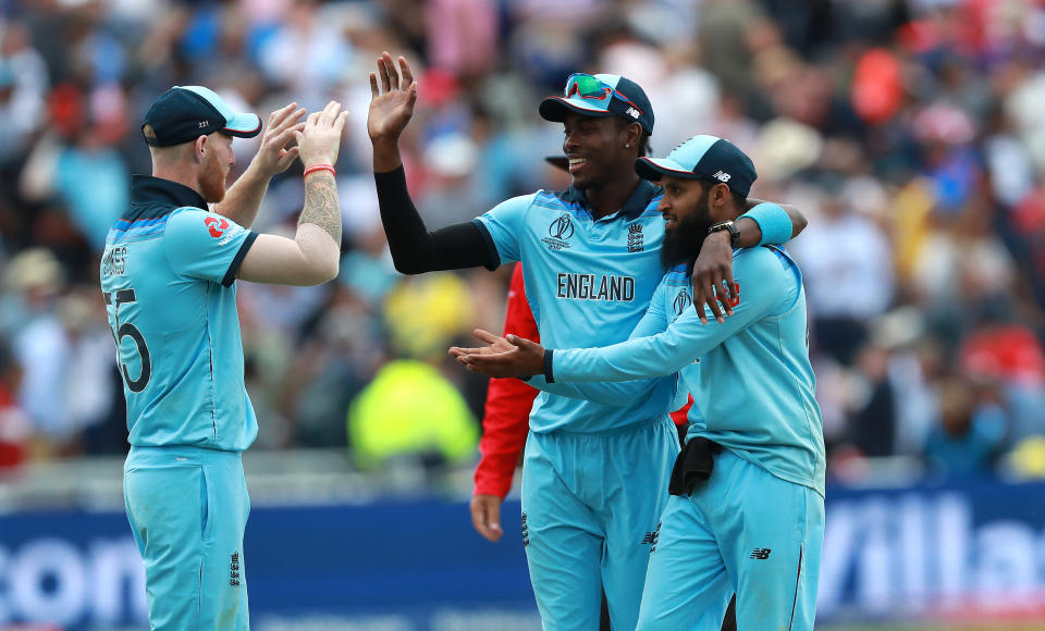 BIRMINGHAM, ENGLAND - JULY 11:   (L-R) Ben Stokes, Jofra Archer and Adil Rashid of England celebrae during the Semi-Final match of the ICC Cricket World Cup 2019 between Australia and England at Edgbaston on July 11, 2019 in Birmingham, England. (Photo by David Rogers/Getty Images)