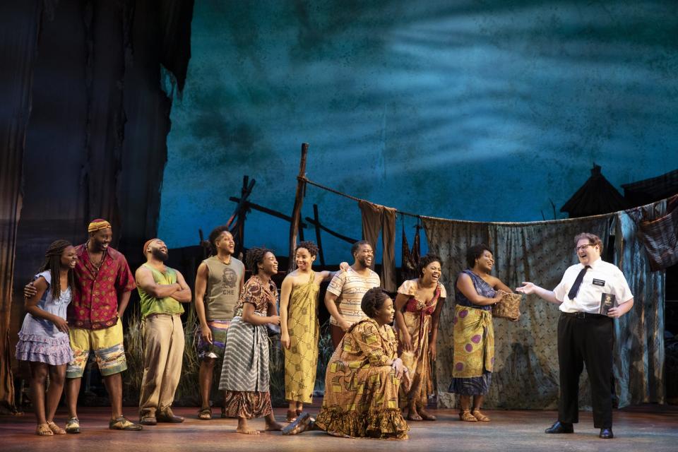 The well-meaning Elder Cunningham (Sam Nackman, right) has only a sketchy relationship with the truth as he speaks with a group of Ugandans in “The Book of Mormon,” running Feb. 20-25 at the Aronoff Center.