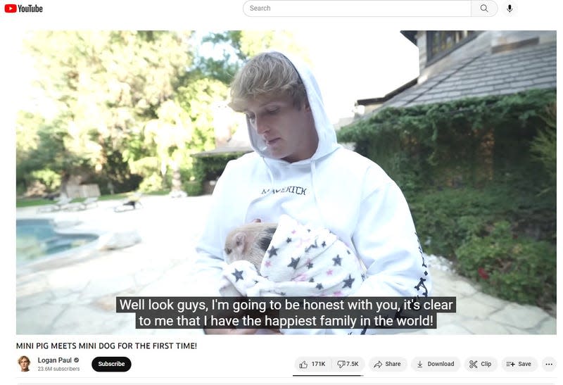 A screenshot of a Logan Paul YouTube video shows him with baby Pearl.