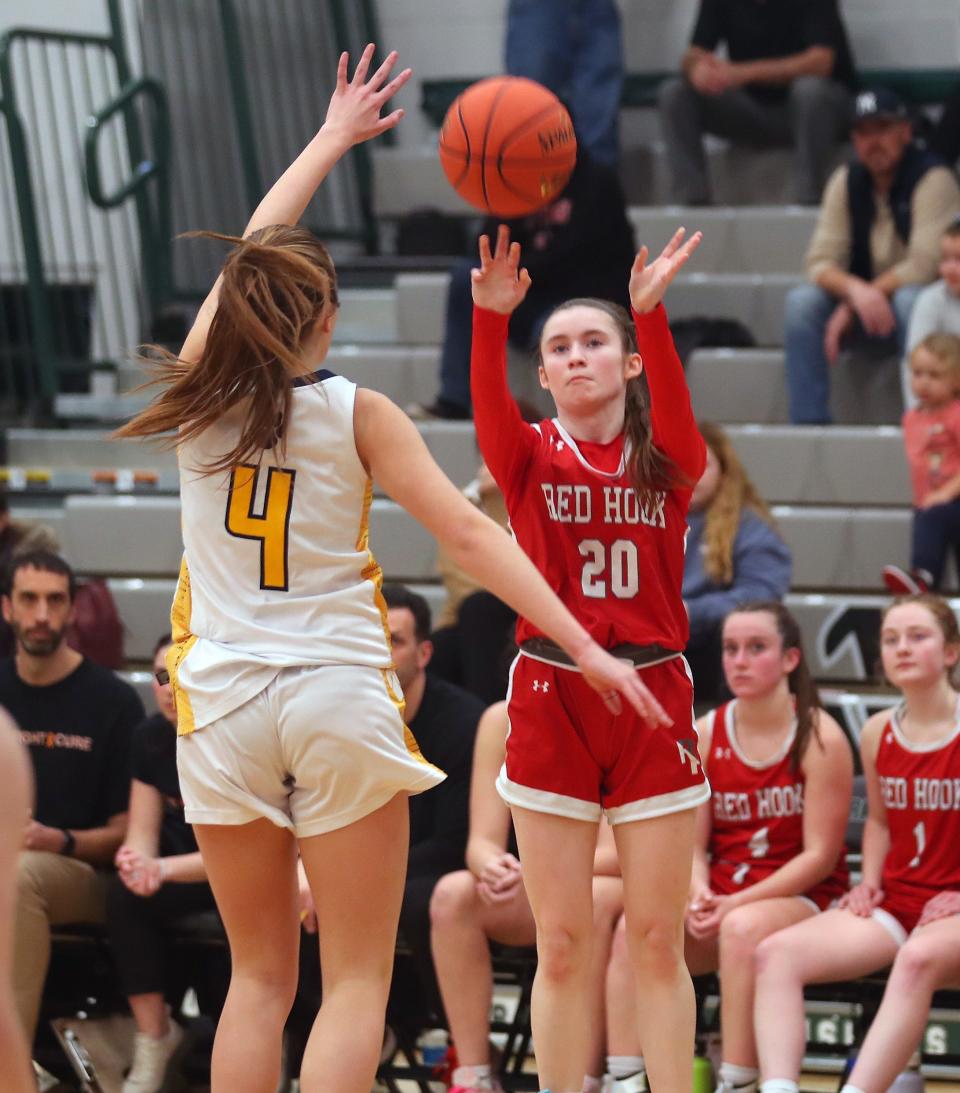 Red Hook's Maddie Clements (20) puts up a shot in front of Panas' Emily Jankowski (4) during the girls Class A regional semifinal at Yorktown High School March 5, 2024. Walter Panas won the game 63-30.