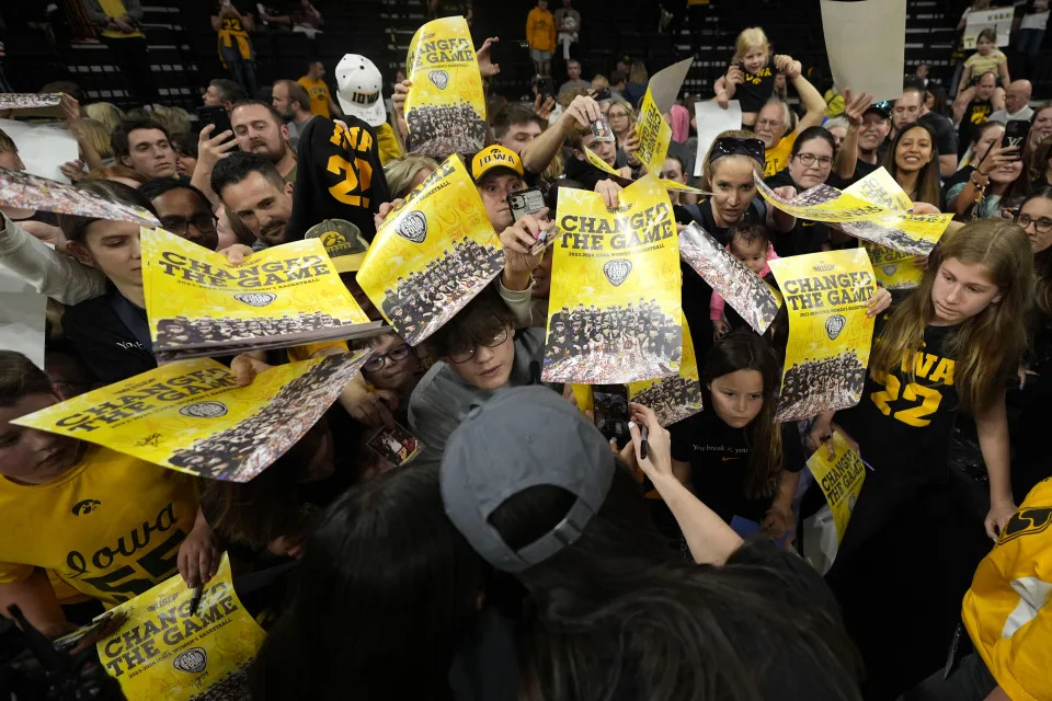 Iowa guard Caitlin Clark signs autographs during an Iowa women's basketball team celebration Wednesday, April 10, 2024, in Iowa City, Iowa. Iowa lost to South Carolina in the championship game of the women's NCAA Tournament on Sunday. (AP Photo/Charlie Neibergall)