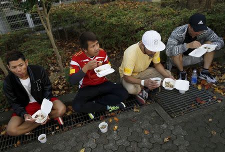 Cambodian residents in Japan have lunch during Asia Sports Festa in Yokohama, south of Tokyo, Japan, October 25, 2015. Picture taken October 25, 2015. REUTERS/Yuya Shino
