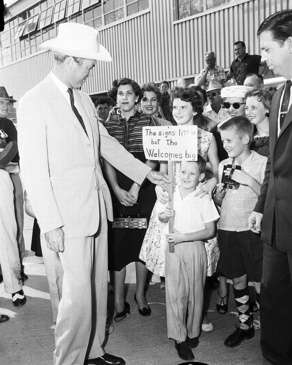 Sept. 3, 1956: Movie actor Jimmy Stewart with fans Bill Parsons and Cherie Johnson who greeted him at Amon Carter Airfield.