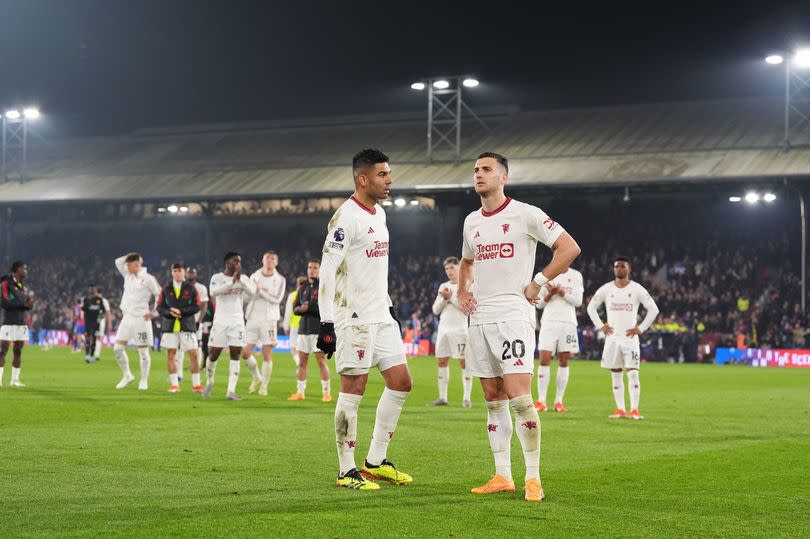 Manchester United's Casemiro (left) and Diogo Dalot react following the Premier League match against Crystal Palace