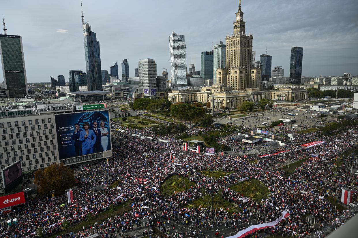 Thousands of people hold Polish and EU flags (Getty Images)