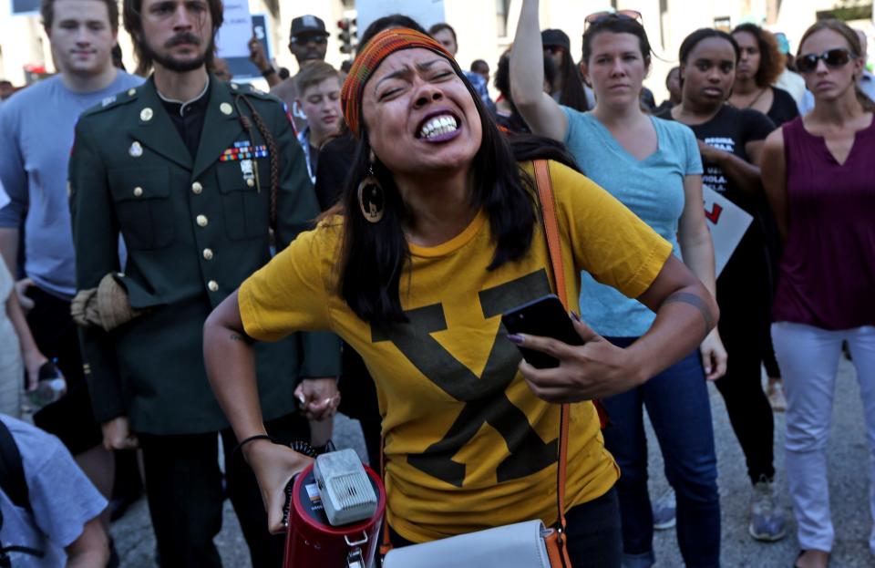 FILE - In this Sept. 15, 2017 photo, LaShell Eikerenkoetter of Jennings, Mo., shouts as she protests the not guilty verdict in the killing of Anthony Lamar Smith by former St. Louis police officer Jason Stockley. When Eikerenkoetter cast her vote for Wesley Bell in the St. Louis County Democratic primary on Tuesday, Aug. 2, 2018, she took the spirit of Michael Brown with her to the ballot box. She had a sole purpose on Election Day: Get rid of Bob McCulloch, the veteran prosecutor who did not get an indictment against the white former Ferguson, Missouri, police officer who fatally shot the unarmed, black 18-year-old four years ago this week. (Laurie Skrivan/St. Louis Post-Dispatch via AP, File)