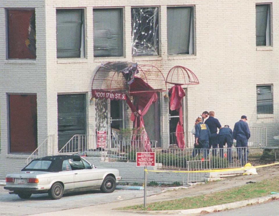 Law enforcement agents from the FBI and the Bureau of Alcohol, Tobacco and Firearms search the ground outside the New Woman All Women healthcare clinic in Birmingham, Alabama, in 1998 after a bomb exploded outside the clinic.