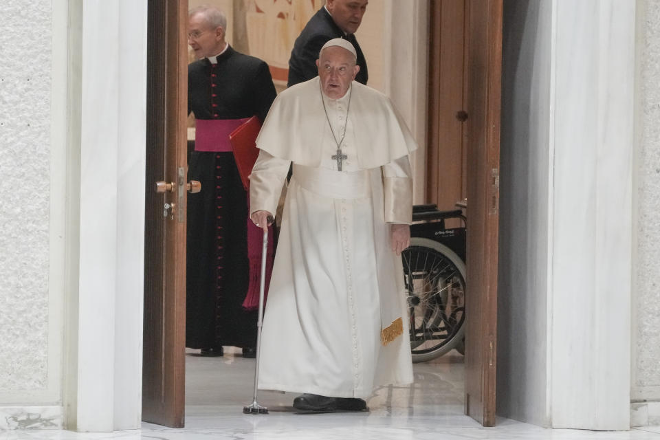 Pope Francis arrives in the Paul VI hall to meet with Vatican employees for the season greetings at the Vatican, Thursday, Dec. 21, 2023. (AP Photo/Gregorio Borgia)