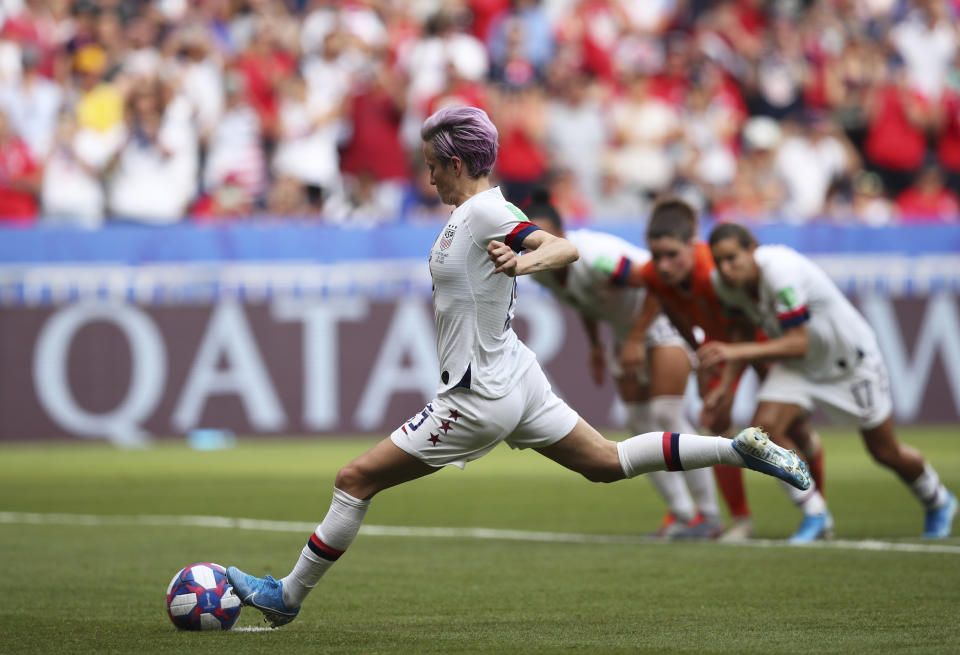 United States' Megan Rapinoe scores the opening goal from the penalty spot during the Women's World Cup final soccer match between US and The Netherlands at the Stade de Lyon in Decines, outside Lyon, France, Sunday, July 7, 2019. (AP Photo/Francisco Seco)