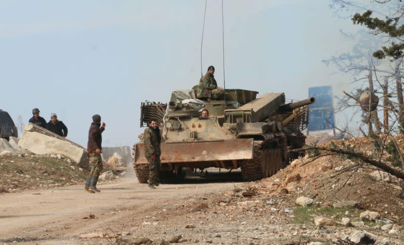 Syrian army soldiers are deployed in the town of Khan al-Assal, west of Aleppo