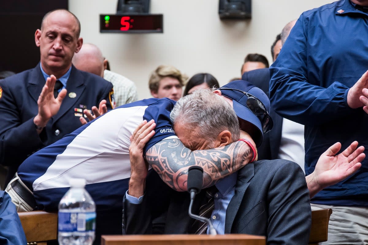 John Feal hugs Stewart during a House Judiciary Committee hearing on reauthorization of the September 11th Victim Compensation Fund in 2019 (Getty Images)