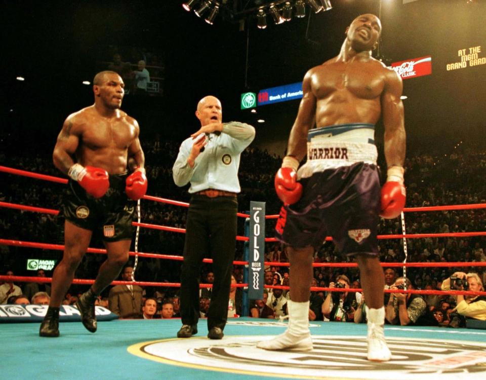 Lane calls a time-out after Mike Tyson's bite on Evander Holyfield - Gary Hershorn/REUTERS