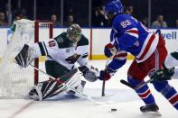 Feb 21, 2019; New York, NY, USA; Minnesota Wild goaltender Devan Dubnyk (40) makes a save against New York Rangers center Mika Zibanejad (93) during the second period at Madison Square Garden. Mandatory Credit: Adam Hunger-USA TODAY Sports