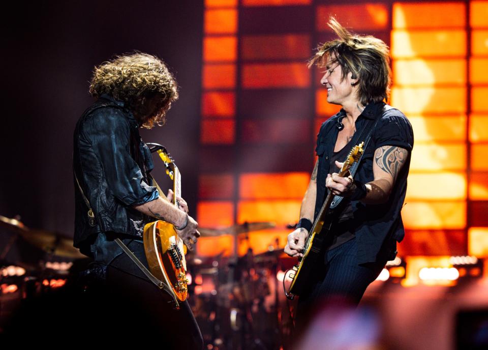 Keith Urban (right) and guitarist Josh Kearney tear up the stage in Las Vegas. Urban's residency returns to the Bakkt Theater at Planet Hollywood (formerly Zappos Theater) June 16.