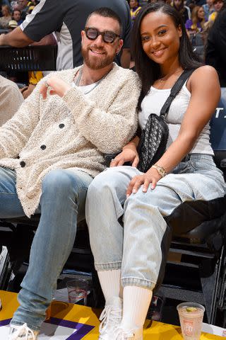 <p>Andrew D. Bernstein/NBAE via Getty</p> Travis Kelce and Kayla Nicole pose for a photo during the game between the Los Angeles Lakers and the Memphis Grizzlies on February 21, 2020 at STAPLES Center in Los Angeles,