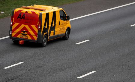 FILE PHOTO: An AA (Automobile Association) recovery vehicle drives along the M6 motorway near Knutsford, northern England, April 8, 2016. REUTERS/Phil Noble /File Photo
