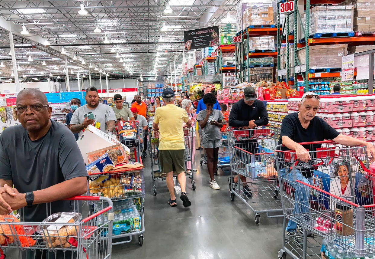 ORLANDO, FLORIDA, UNITED STATES - 2022/05/31: Shoppers wait in a check-out line at a Costco wholesale store in Orlando. Costco reported a double-digit rise in sales during the third quarter and record numbers of new members as consumers look for ways to fight rising food prices caused by inflation. (Photo by Paul Hennessy/SOPA Images/LightRocket via Getty Images)