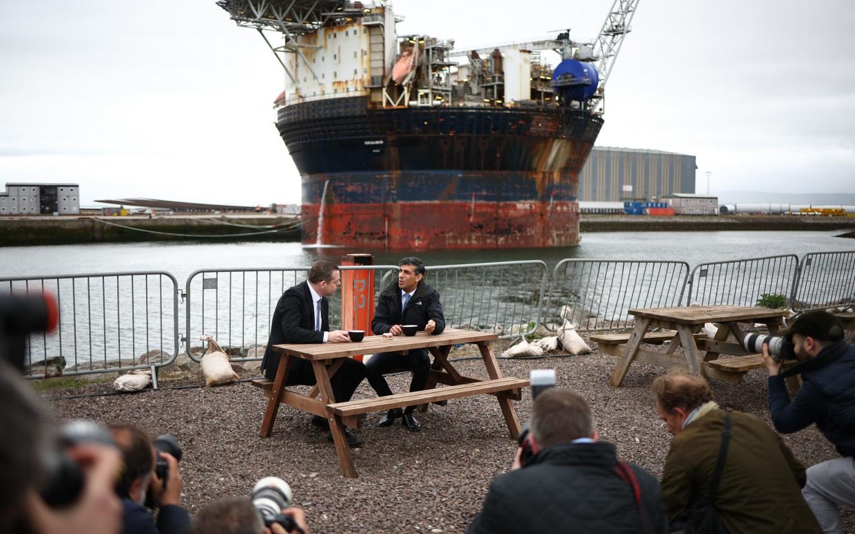 Mr Sunak and Douglas Ross, leader of the Scottish Conservatives, speak at the port