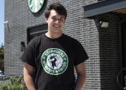Joe Thompson stands in front of Starbucks in Santa Cruz, Calif., on May 20, 2022. It’s become a common sight: jubilant Starbucks workers celebrating after successful votes to unionize at dozens of U.S. stores. But when the celebrations die down, a daunting hurdle remains. To win the changes they seek, like better pay and more reliable schedules, unionized stores must sit down with Starbucks and negotiate a contract. I(Joe Thompson via AP)