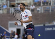 Marin Cilic, of Croatia, reacts after defeating John Isner, of the United States, in the round three of the US Open tennis championships Saturday, Aug. 31, 2019, in New York. (AP Photo/Michael Owens)