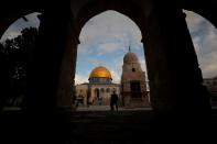 The Dome of the Rock is seen in the background as people visit the compound known to Jews as Temple Mount and to Muslims as Noble Sanctuary, in Jerusalem's Old City