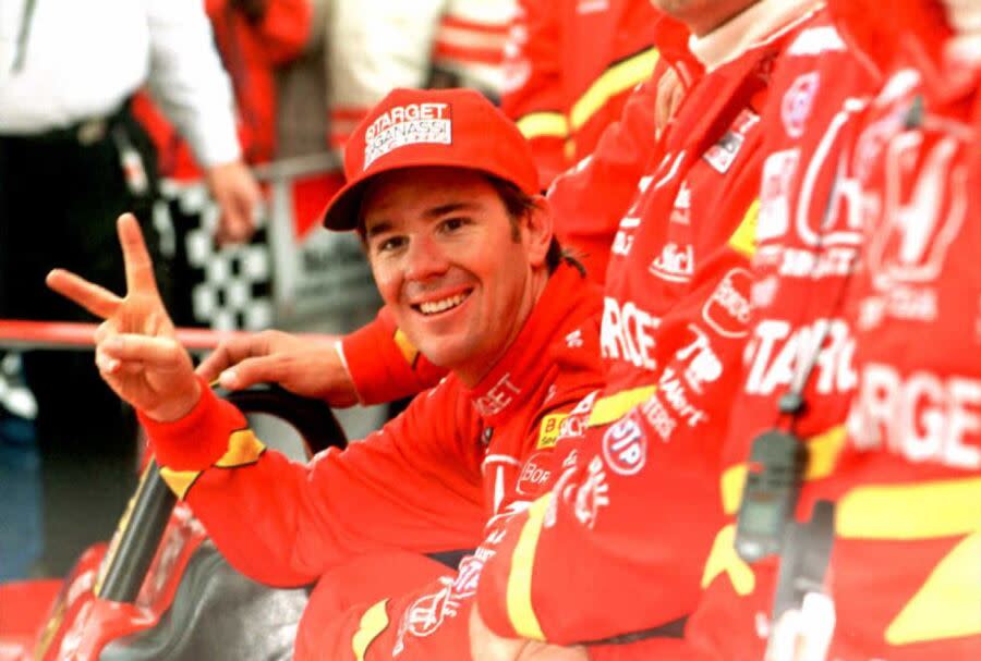 US driver Jimmy Vasser (L) celebrates his victory