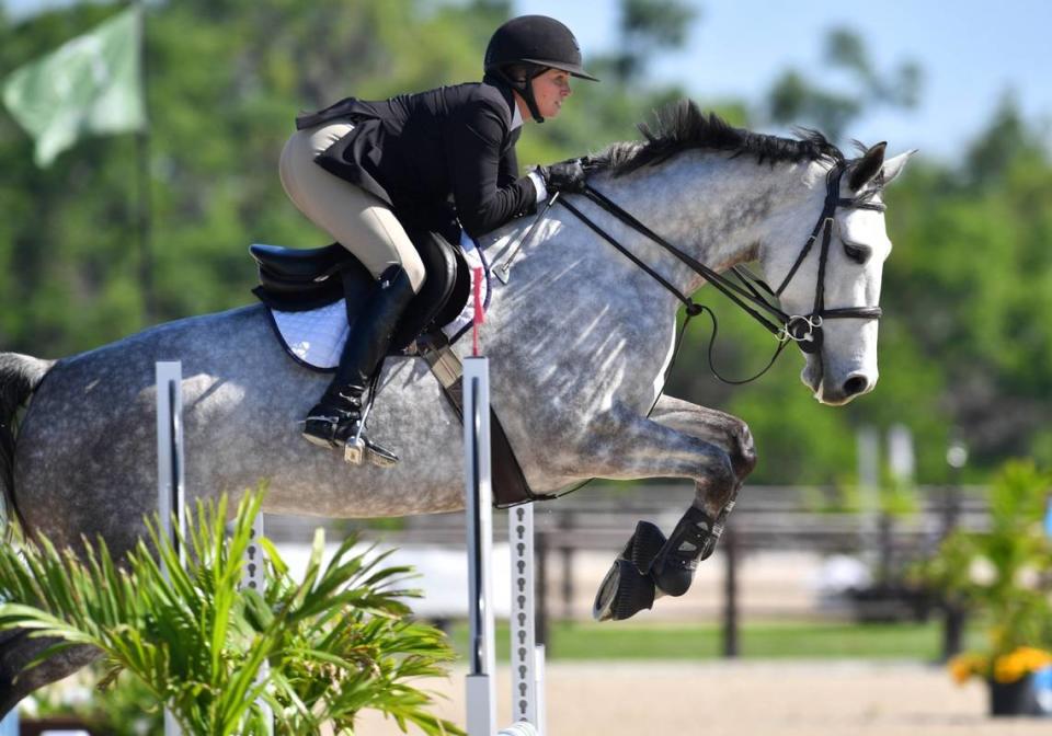 A competitor navigates the show jumping course next to the VIP Pavilion at the TerraNova Equestrian Center in Myakka City on Wednesday, Mar. 20, 2024.
