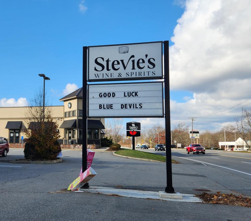 The sign outside of Stevie's Wine & Spirits at 115 Huttleston Ave. reads "GOOD LUCK BLUE DEVILS" on Tuesday morning, as Fairhaven High gets ready for Thursday's Super Bowl against Salem.