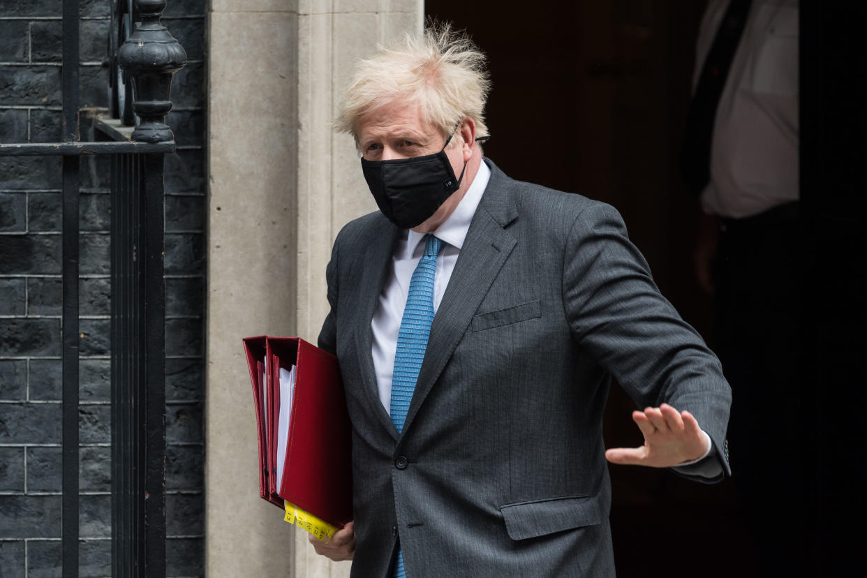 LONDON, UNITED KINGDOM - APRIL 28, 2021: British Prime Minister Boris Johnson leaves 10 Downing Street for PMQs at the House of Commons, on 28 April, 2021 in London, England. (Photo credit should read Wiktor Szymanowicz/Barcroft Media via Getty Images)