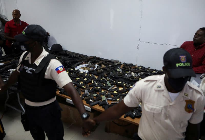 FILE PHOTO: Weapons confiscated by the police over a period of six months are presented to the media