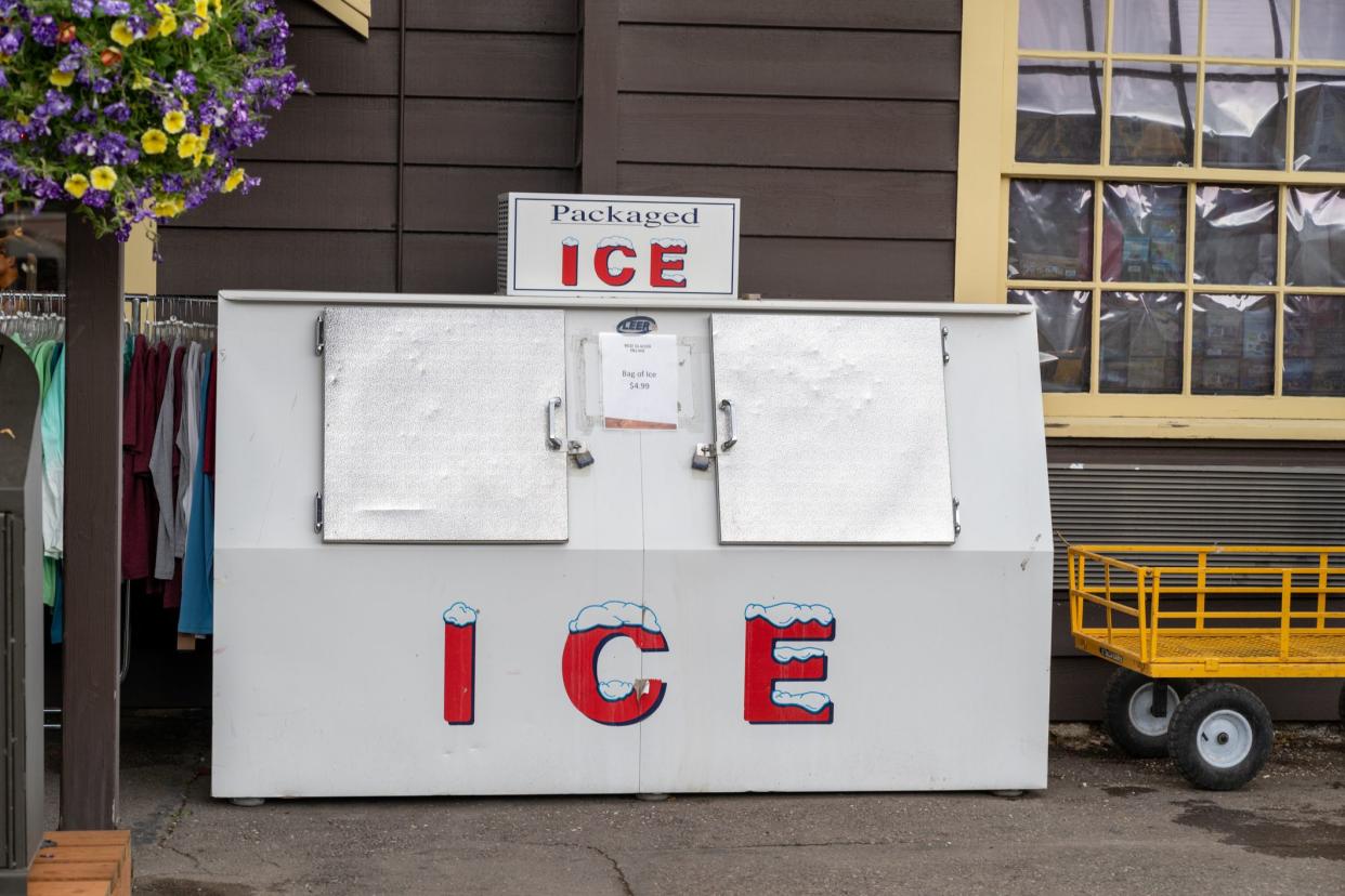 West Glacier, Montana - July 3, 2022: Freezer full of bagged ice for sale outside of a gas station