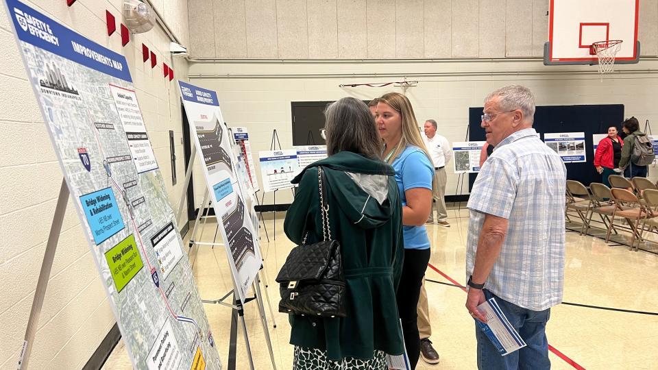 Allee Hersman with Parsons Corporation explaining the proposed bridge widening plan over Morris and Prospect streets to city-county counselor, Frank Mascari, and Beth Brandon at the public hearing for I-65 Safety & Efficiency on Wednesday, July 24, 2024.