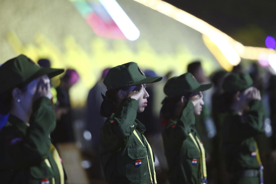 Military soldiers salute during a parade to commemorate Myanmar's 79th Armed Forces Day, in Naypyitaw, Myanmar, Wednesday, March 27, 2024. (AP Photo/Aung Shine Oo)