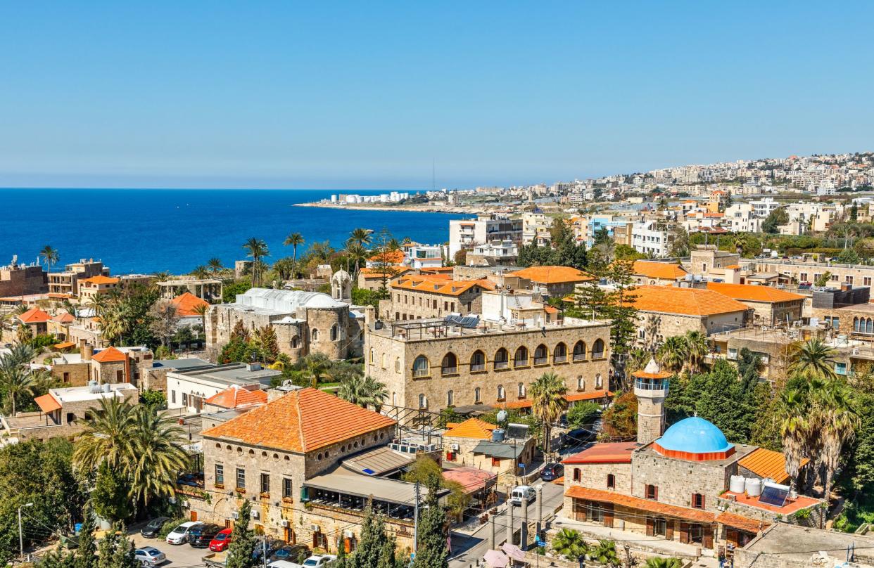 Mediterranean city historic center panorama with old church and mosque and residential buildings in the background, Byblos, Lebanon