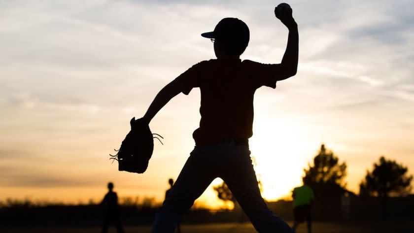 Kaiden Wells, 10, throws a baseball during Odessa Rage Youth baseball team practice Wednesday, Jan. 28, 2015, in Odessa, Texas. (AP Photo/Odessa American, Courtney Sacco)