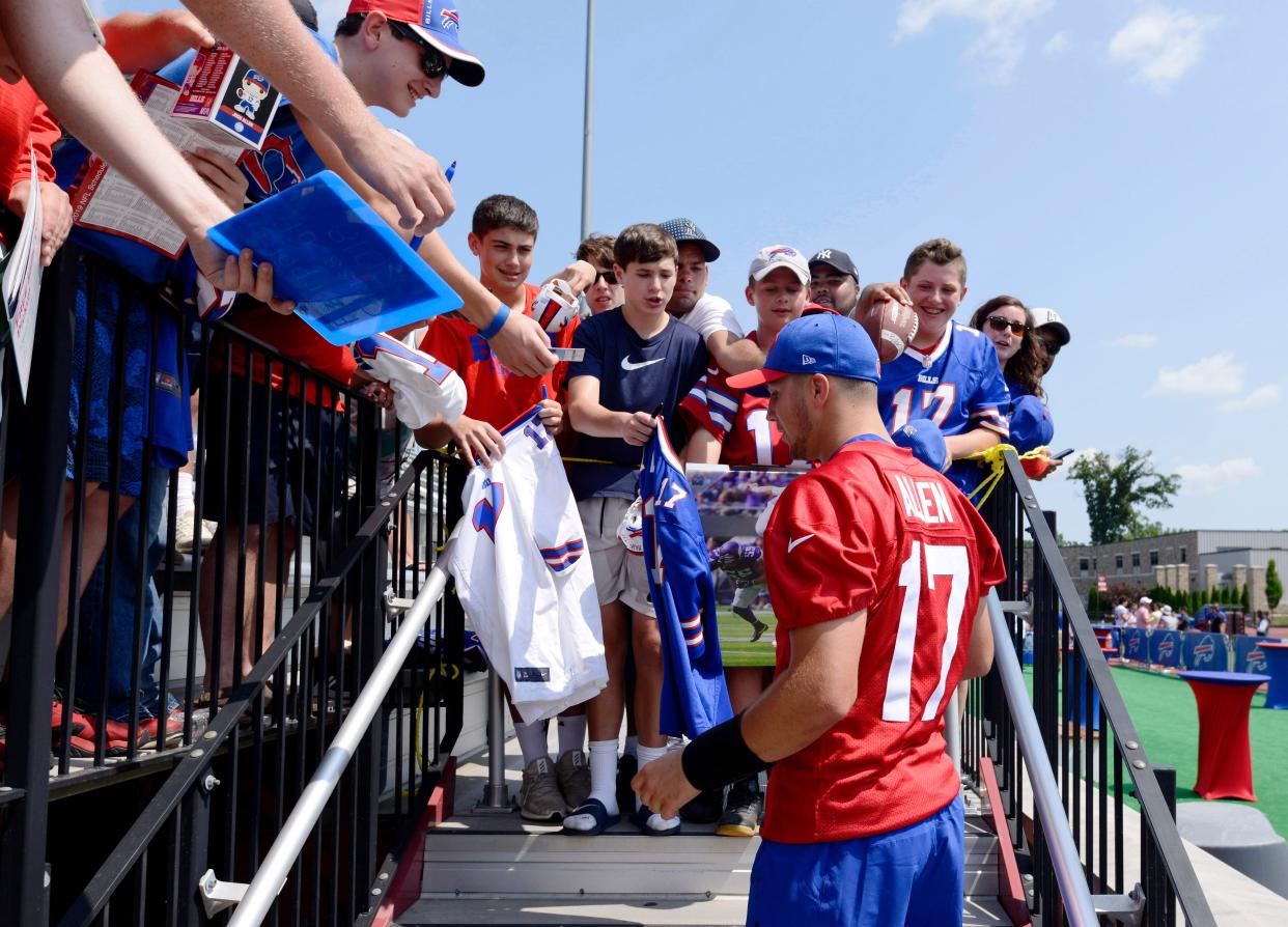 Josh Allen signing autographs when the Bills were last at St. John Fisher College in 2019.