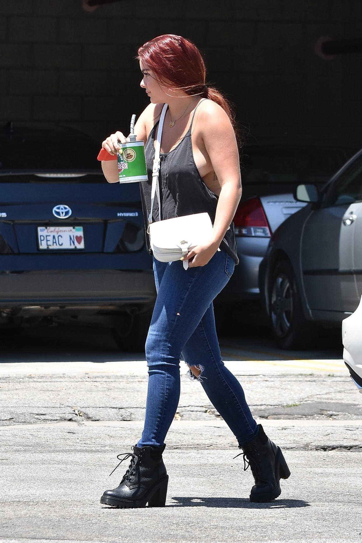 Los Angeles, CA  - *EXCLUSIVE*  - Ariel Winter opts for no bra as she shows off some major side boob as she heads to the studio. Ariel shows off her assets in a loose fitting top with no bra, jeans, and black boots.  Pictured: Ariel Winter  BACKGRID USA 20 JULY 2017   USA: +1 310 798 9111 / usasales@backgrid.com  UK: +44 208 344 2007 / uksales@backgrid.com  *UK Clients - Pictures Containing Children Please Pixelate Face Prior To Publication*