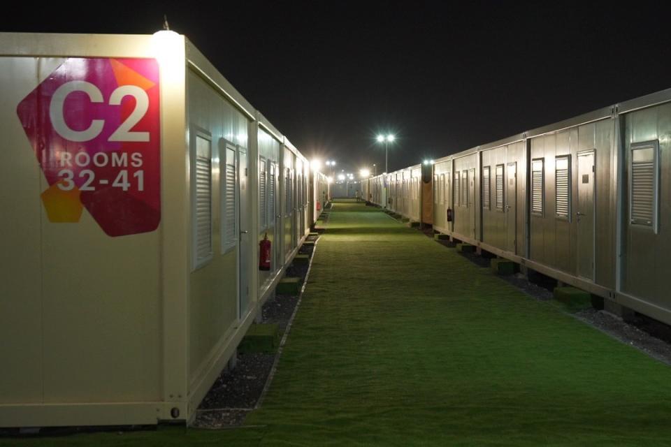 A deserted section of the Free Zone Fan Village is seen in Doha, Qatar, Wednesday, Nov. 23, 2022. For scores of foreign soccer fans, the road to the World Cup in Doha starts every morning at a barren campsite in the middle of the desert. Visitors who found hotels in central Doha booked up or far beyond their budget have settled for the faraway, dust-blown tent village in Al Khor, where there are no locks on tents nor beers on draft. Others are staying at the Free Zone Fan Village, directly under the path of an airport. (AP Photo/Jon Gambrell)