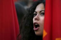 A supporter of the Greek Communist Party shouts slogans during a rally on Constitution (Syntagma) square, near the parliament building, in Athens, Greece, July 2, 2015. REUTERS/Jean-Paul Pelissier