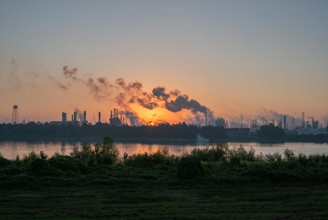 <span class="caption">'Cancer Alley' is an 80-mile stretch of chemical plants along the Mississippi River in Louisiana alongside many Black and poor communities.</span> <span class="attribution"><a class="link " href="https://www.gettyimages.com/detail/news-photo/smoke-billows-from-one-of-many-chemical-plants-in-the-area-news-photo/893900758?adppopup=true" rel="nofollow noopener" target="_blank" data-ylk="slk:Giles Clarke/Getty Images;elm:context_link;itc:0;sec:content-canvas">Giles Clarke/Getty Images</a></span>