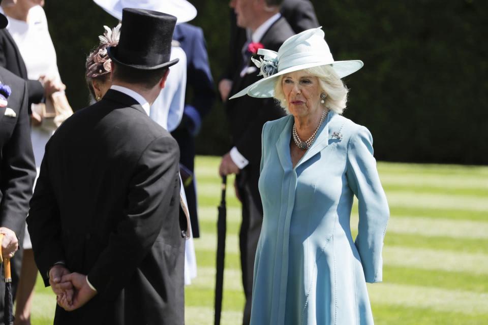 <p>Camilla opted for an all-blue ensemble at the first day of the Royal Ascot, wearing a coat by Anna Valentine and hat by Philip Treacy.</p>