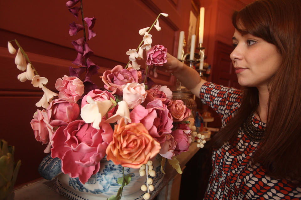 �A vase of edible roses are on display at the cake hotel. The delicious furnishings were made by baker 'Ms. Cakehead' and fellow cake artists The Meringue Girls, Nevie Pie, Conjurers Kitchen, Carina’s Cupcakes, Sarah Hardy Cakes and Cake For Breakfast (PA)