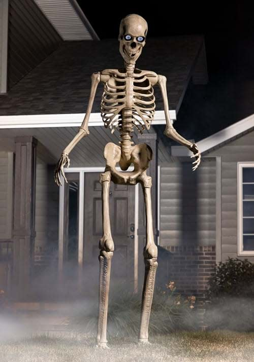 8 foot animated skeleton in front of a house