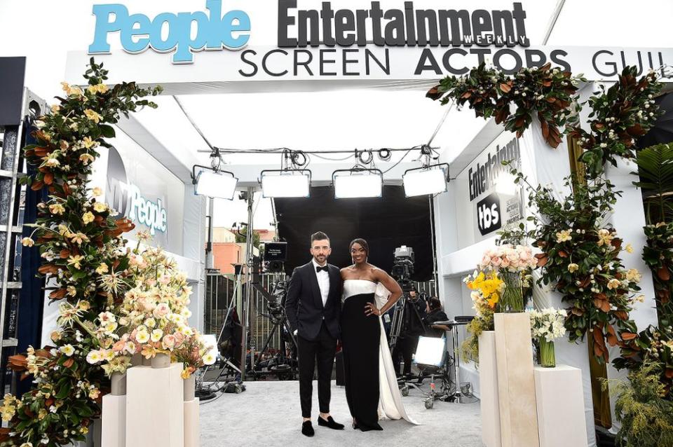 Lyons' work on the People, Entertainment and TNT platform (pictured: cohosts Jeremy Parsons and Lola Ogunnaike) | John Shearer/Getty