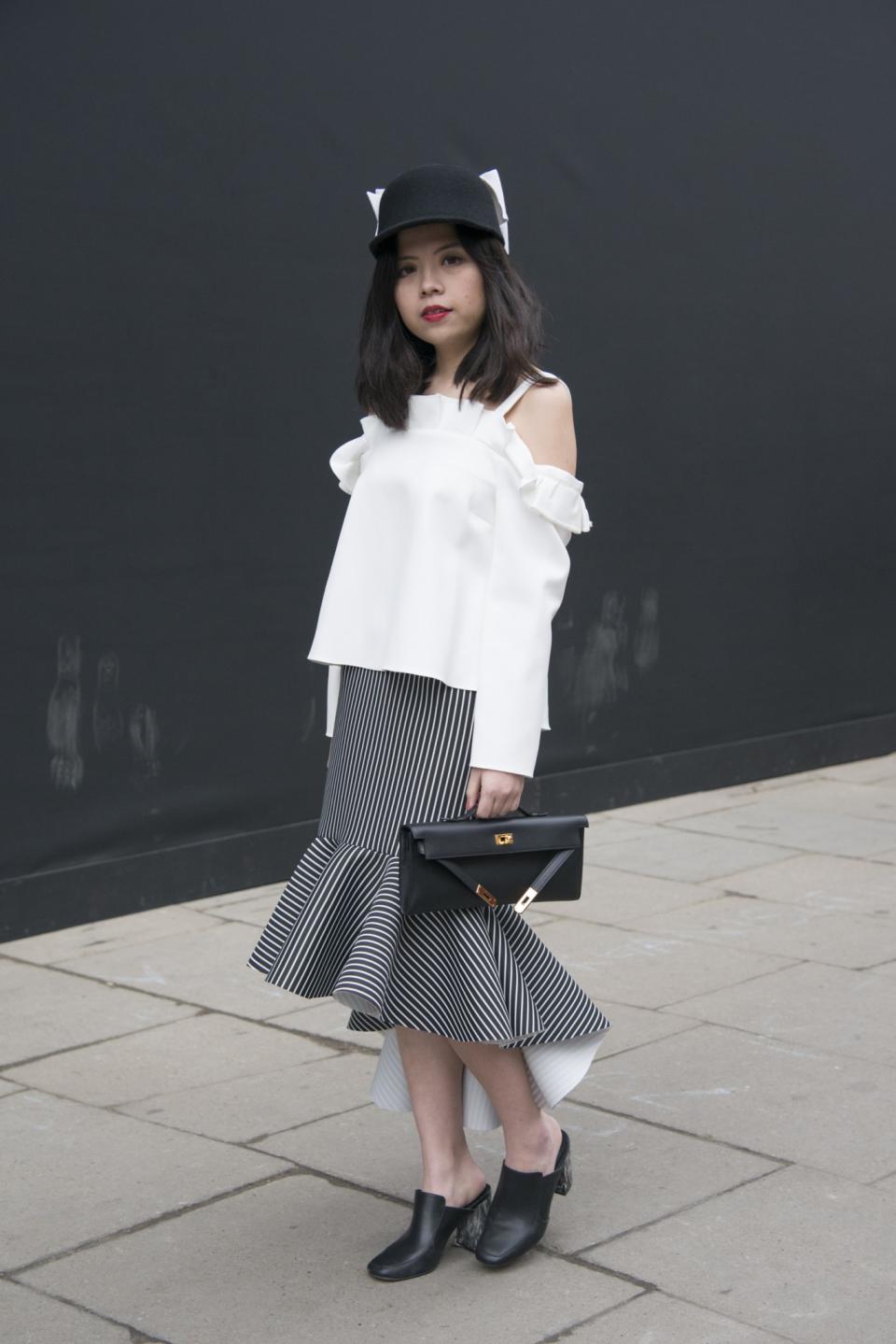 <p>Fashion editor at Favour-Up Magazine, Veronica Chang, wears a Topshop top, Hermes bag and hat from a Parisian boutique. [Photo: Kirstin Sinclair/Getty Images] </p>