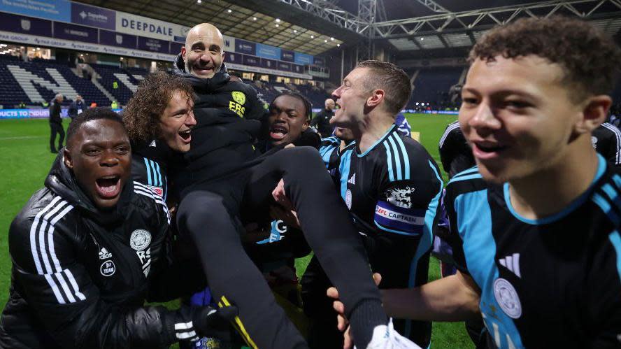 Leicester City players celebrate with Enzo Maresca after winning the Championship title